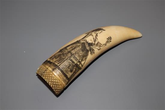 A 19th century scrimshaw sperm whale tooth,